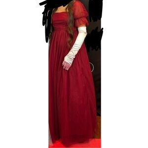 Elegant Red Gown with White Gloves
